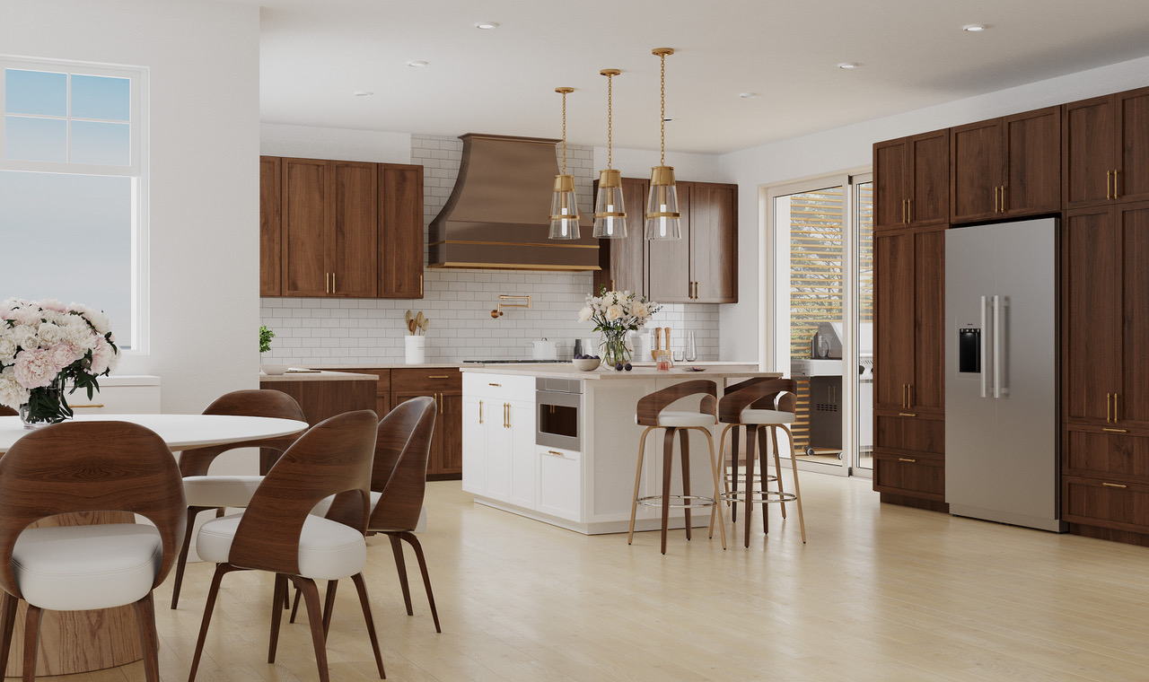 Custom kitchen with walnut cabinetry, white island and brass pendant lights by Lighthouse Kitchens